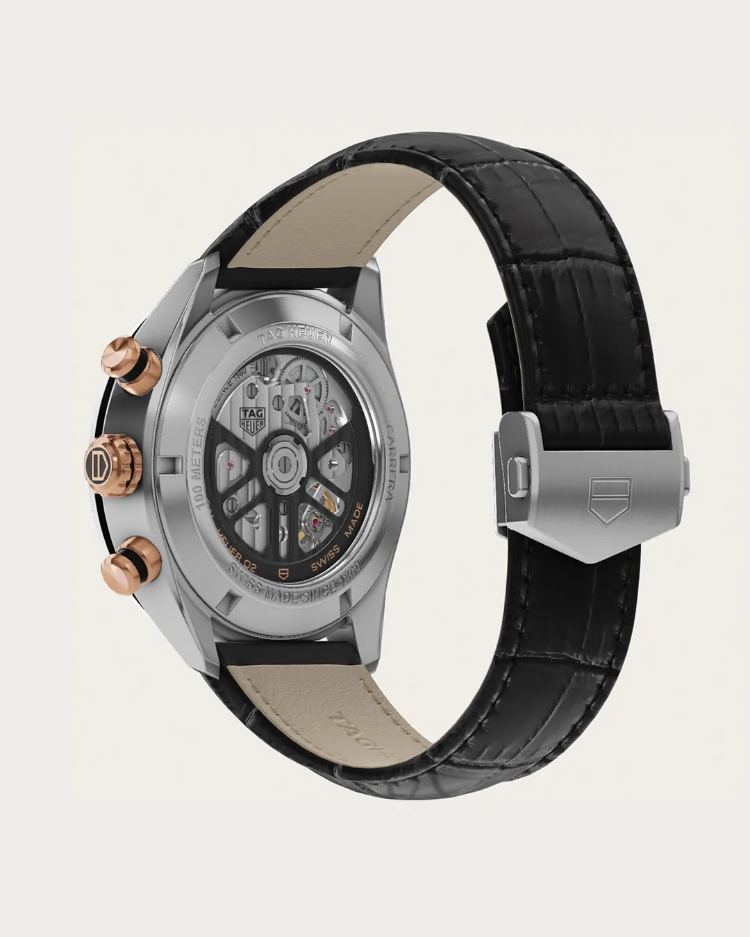 TAG Heuer Carrera chronograph watch with black dial, rose gold accents, and leather strap sideways